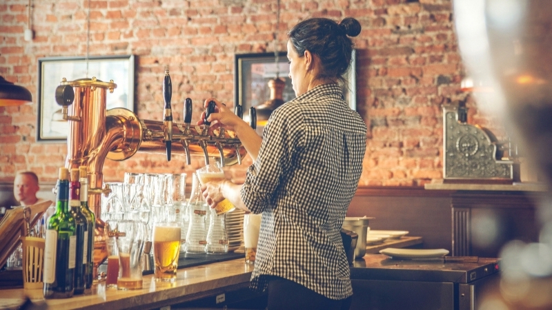 Image Of A Bartender Pouring A Pint Of Beer.jpeg