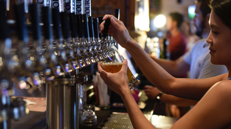 Bartender Pulling A Pint In A Pub.png