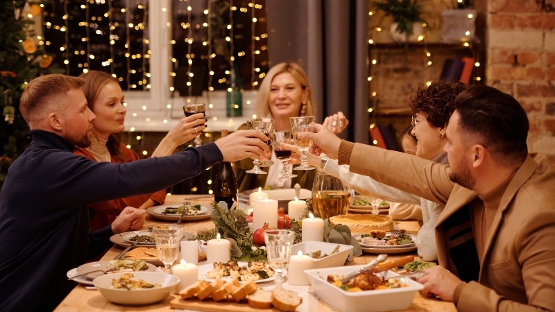 Image Of A Group Of People At A Table Celebrating.jpeg